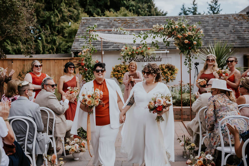 Orange and red queer wedding | Photo by LGBTQ Photographer Studio XIII Photography
